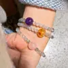 Cuerpo de vidrio lleno de luz azul piedra lunar gris de alta calidad cristal amarillo cristal rosa amatista sentido del diseño pulsera de múltiples círculos pulsera