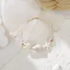 Jingdezhen Navidad Pulsera de Cuerda Trenzada de Cerámica Pulsera de Trébol de Cuatro Hojas Joyería Artística Hecha a Mano Venta al por Mayor Pulseras de Cerámica para Atracciones Turísticas