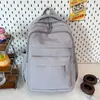 Mochila estilo minimalista para mulheres, novo modelo 2026, grande capacidade, multicamadas, durável e adequada para estudantes e viagens