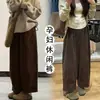 Calça de veludo cotelê de corte solto para maternidade para outono e inverno, estilo coreano, projetada para cobrir os quadris, criar um efeito emagrecedor e ser versátil para uso casual