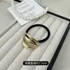 Anillo para el Cabello Minimalista Europeo y Americano Estilo Frío Sentido del Diseño Metal Hueco Cuerda Dorada para la Cabeza Cabeza de Bola Banda de Goma Sentido Avanzado Atar