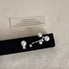 Brincos de Pérola Suspensa com Céu Estrelado Minimalista para Mulheres com Design de Luxo Leve, High-End e Assimétrico