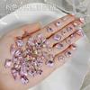 Accesorios populares para uñas Diamante K9 puntiagudo polvo flor de cerezo rosa súper brillante corazón torcido huevo de paloma rectangular diamante para pegar en uñas al por mayor