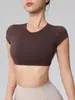 Camiseta Deportiva de Manga Corta Wangtu Ombliguera para Yoga con Almohadilla en el Pecho Fitness Running Deportes Fábrica de Comercio Exterior Se puede imprimir
