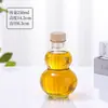 Botella Calabaza Verde Creativa en Stock Botella de Vino Ciruela Botella para Bebidas de Té Celebridad de Internet Botella Transparente para Vino de Frutas Vino Sellado con Tapa