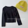 Nuevo estilo de otoño para niñas, versión coreana, diseño simple, que expone la cintura, cruzado, color liso, cuello redondo, hombro normal, longitud corta, camiseta de manga larga