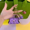 Bolsa Pequena de Couro Vintage Criativa para Venda por Atacado Chave Mini Armazenamento Fone de Ouvido Fivela Borla Porta-Moedas Armazenamento Criativo