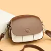 Bolso pequeño cuadrado bicolor para mujer, nuevo bolso tipo saddle vintage 2025, bolso pequeño versátil casual de hombro y cruzado, bolso de mano simple de cuero suave
