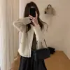 Enviado: Cardigan de outono novo, chique coreano, doce, com trança vazada, suéter de tricô casual solto feminino 19924