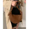 Bolsa de axila con textura de nicho al por mayor para mujer 2025 Nuevo estampado de leopardo Gamuza Bolsa tipo dumpling de moda Bolso de hombro cruzado