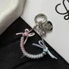 Cadena de hueso de serpiente de cable telefónico nueva y creativa con lazo personalizado, decoración versátil para bolso y accesorio para funda de teléfono