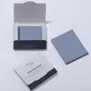 Carbón de bambú reemplazo cara gamuza papel absorbente de aceite cara maquillaje con espejo borla de polvo papel absorbente de aceite al por mayor