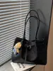 Bolsa de mano para el trabajo, bolsa de gran capacidad para mujer, nuevo modelo de primavera 2026, bolso de hombro de nicho súper popular, bolso de mano moderno para salir
