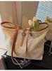 Bolso de gran capacidad tejido de paja versión coreana transfronteriza 2025 primavera nuevo bolso tejido estilo extranjero vacaciones hombro tote