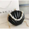 Bolsa de Mão de Moda Transfronteiriça para Noite Feminina 2026 Nova Sensação de Alto Padrão Bolsa Envelope Vermelho Ombro Único Transversal Bolsa Concha