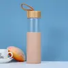 Comercio exterior 16 oz boca ancha cuerda para levantar tapa de bambú taza de silicona anti-quemaduras juego de tazas resistente a altas temperaturas capa única vidrio de borosilicato alto taza de agua portátil