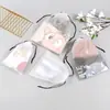 Las bolsas de plástico con cordón se pueden usar como empaques transparentes impermeables para llevar y bolsas de almacenamiento, se pueden imprimir con logotipos y son bolsas de PE a prueba de polvo