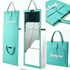 Espejo de cuerpo entero portátil de fieltro al por mayor, espejo de tocador plegable de pared, espejo de mano para guardar, adecuado para dormitorios y uso doméstico, personalizable