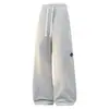 Calça larga com corte split-line estilo high street americano para homens, cintura elástica, cordão branco, versátil, com efeito de caimento, calça de moletom casual, tamanhos grandes