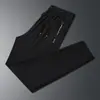 Calça de Seda de Gelo Masculina Verão Fina Secagem Rápida Esportiva Casual Masculina Malha Solta Caimento Nove Pontos Ar Condicionado Tendência Calça