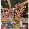 Ramas de flor de cerezo flor de durazno falsa plantas verdes de techo decoración enredaderas de flores de interior pared de celebridad de internet supermercado restaurante habitación cubierta superior fealdad