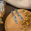 Aretes de perlas transfronterizos europeos y americanos de alto sentido retro pluma turquesa aretes bohemios al por mayor