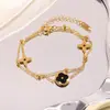 Pulsera de Acero de Titanio Chapado en Oro Real de Cuatro Hojas de Doble Capa de Venta Caliente Transfronteriza Europea y Americana Joyería de Acero Inoxidable de Alta Gama que No se Desvanece