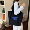 Bolsa de Relaxamento Preguiçoso 2025 Nova Deslocamento Diário Casual Combina com Tudo Estudante Lona Única Letras Bolsa Tote