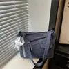 Otoño 2026 Nuevo Bolso de Mezclilla Bolso Cruzado Casual Estilo Perezoso Bolso de Tela Artístico para el Trabajo Bolso Cruzado Pequeño