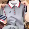 Camiseta Bordada de Manga Corta con Botones y Solapa Talla Grande para Mujer Primavera y Verano 2025 Nuevo Top de Moda Holgado que Adelgaza y Cubre la Piel para Mujer