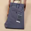 Pantalones de traje de negocios para hombre de ajuste recto y delgado, elásticos en cuatro direcciones, de nailon, finos, sin planchar, antiarrugas, pantalones casuales para hombre de primavera y verano