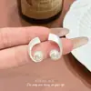 Diseño de estilo indiferente sentido del diseño simples aretes de perla en espiral de plata nicho exquisitos luz de lujo sentido de alta gama aretes versátiles para mujer