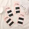 Ning Meng alta calidad tarjeta de papel de dibujos animados clip de pinza para el pelo negro clip de acero placa de barniz para hornear tarjeta para el pelo joyería tienda de 2 yuanes caliente