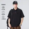 Camisa Polo de Verano para Hombre Xintang, estilo americano, corte holgado, manga corta, con cuello camisero, acabado vintage lavado a la nieve