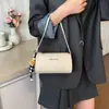 Bolsa de almohada con patrón tejido de nicho transfronterizo para mujer, nuevo modelo 2026, bolso de mano Maillard de alta gama, bolso de hombro y cruzado
