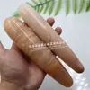 Fabricante de origen gema de cristal natural Jade Dongling rojo pene artificial juguetes sexuales para adultos varita para la vulva para mujeres
