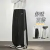 Pantalones de chándal a rayas estilo americano, nueva colección de otoño, corte holgado, caída fluida, diseño de bloques de color, detalles bordados, versátiles para deportes y uso casual, de longitud larga