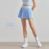 Saia de Yoga Elástica Aidu de Cintura Alta Emagrecedora com Forro para Evitar Exposição, Saia de Tênis com Bolsos, Saia Plissada Casual para Uso Externo