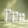 Botella dispensadora de loción al vacío en stock 50g, botella de cuidado de la piel blanca con tapa de presión electrochapada 15ml, botella de muestra portátil para viajes