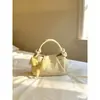 Bolsos exquisitos al por mayor con forma de nube amarilla para mujer, nueva colección de verano 2026, de alta gama, ligeros y elegantes, tipo bandolera