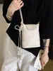 Moda transfronteriza exquisita de alta gama 2026 nuevo bolso de teléfono simple para mujer de diseño nicho primavera-verano, para llevar al hombro y cruzado