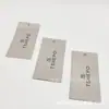 Fábrica certificada FSC de Dongguan: etiquetas colgantes blancas personalizadas, etiquetas colgantes para artículos de cuero y etiquetas colgantes de papel con agujeros perforados para pasar la cuerda