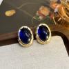 Pendientes vintage antiguos medios de alta fijación ovalados con textura ojo de tigre marcados Diseño nicho Lujo ligero Pendientes de alta gama