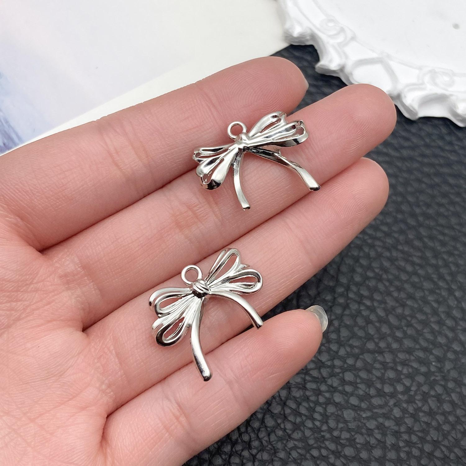 21407-DL-白k保色锌合金双层镂空蝴蝶结19x22mm