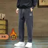 Calças masculinas de inverno Novo padrão chinês bordado soltas combinam com tudo leve maduro casual calças masculinas com amarração no tornozelo calças de moletom