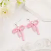 Novos brincos minimalistas transfronteiriços com senso de design, brincos de fita rosa, sensação de luxo leve e alta qualidade, atacado
