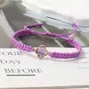 Pulsera tejida de nudo plano de trébol de cuatro hojas de venta caliente transfronteriza para parejas y estudiantes, tendencia europea y americana inspirada en la dopamina, joyería al por mayor de fabricante