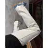 Jeans con vibra de calle americana, estampado de rayos de moda, pantalones acampanados de corte recto slim-fit para hombre, pantalones de corte curvo adelgazantes