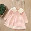 Vestido de Tricô Infantil Aikyung para Meninas Outono Inverno 2026 Novo Estilo Coreano Vestido de Tricô Gola Redonda Saia para Menininha