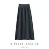 Saia midi de malha estilo suave de caxemira para mulheres Outono/Inverno 2026 cor sólida reta linha A cintura elástica saia macia e lisa de comprimento médio